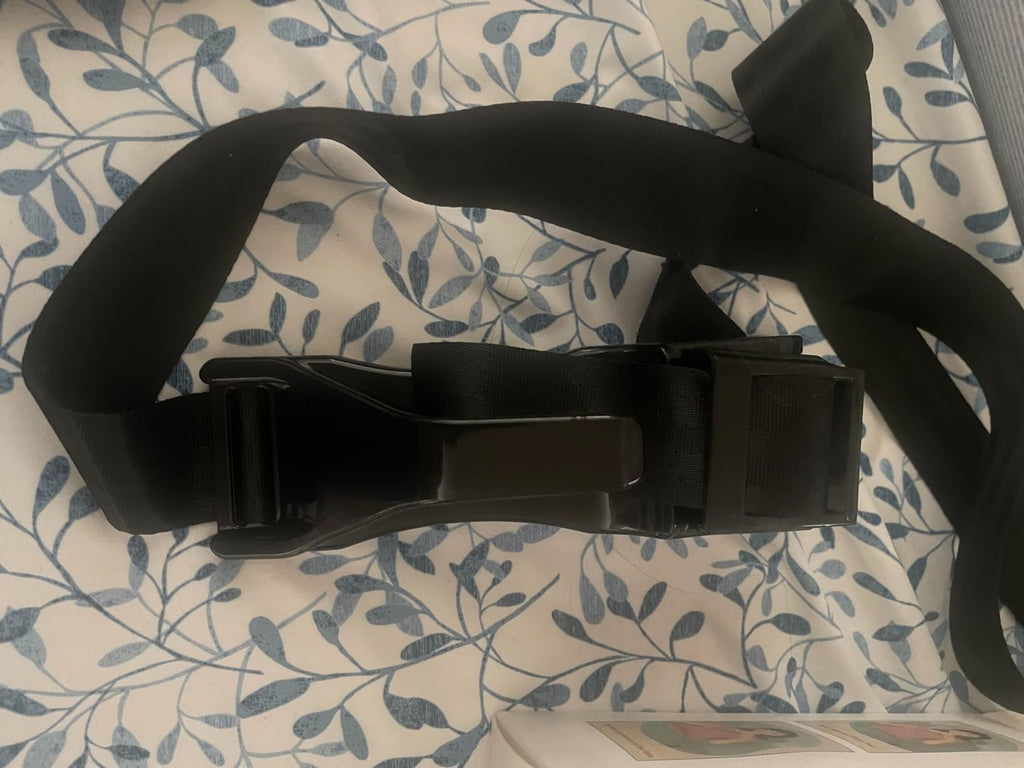 Pregnancy seat belt adjuster in use by an expectant mother in a car